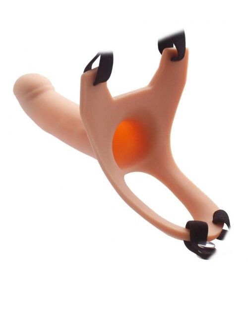 A silicone curved dildo with an attached harness. The dildo is flesh-colored, and the harness is black with adjustable straps.
